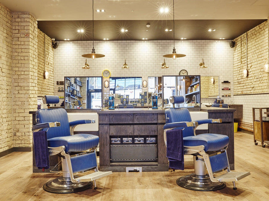 Industrial style hairdressers with flat pendants and exposed brick walls