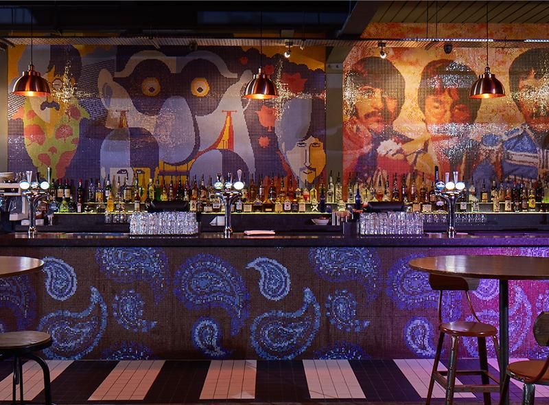 Bar interior with abstract design and industrial lighting