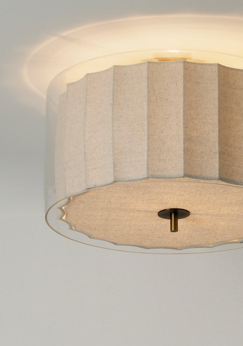 Bude Circular Flush Mount with Linen and Clear Glass shades, lit up