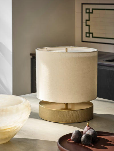 Knurled Round Table Lamp in Brass Finish with a Natural Cotton Drum Shade