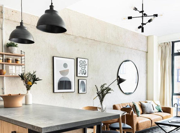 An open plan living space decorated in earth tones