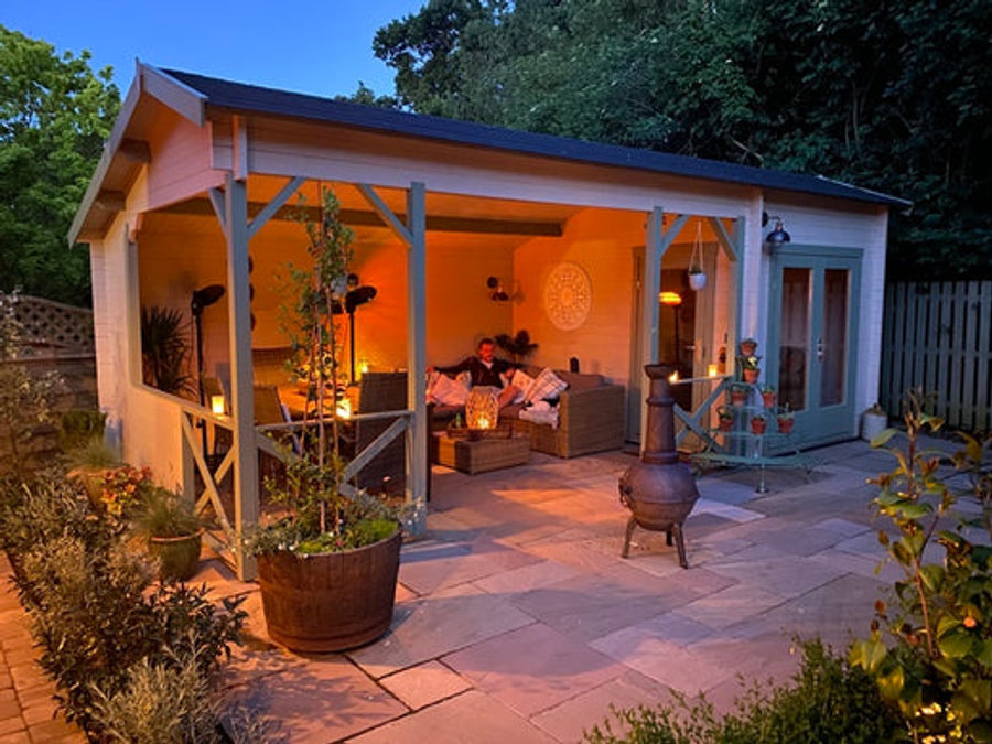 A garden room illuminated different light sources. 