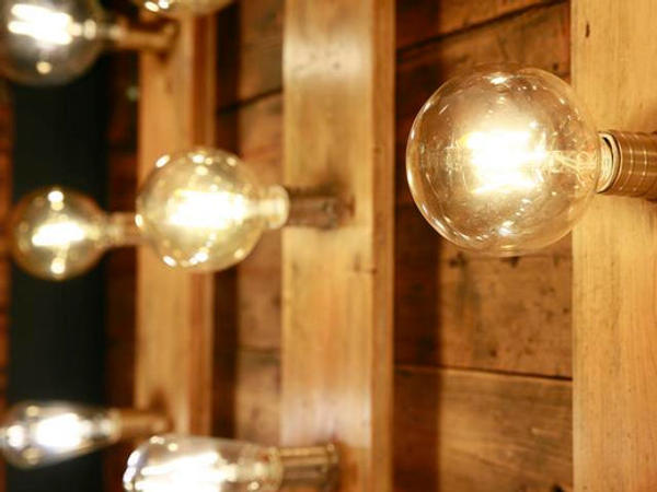 A series of Industville bulbs displayed on a wall. 