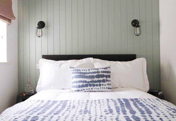A simplistic nautical bedroom interior with industrial wall lights by Industville