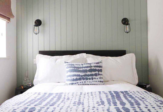 A simplistic nautical bedroom interior with industrial wall lights by Industville