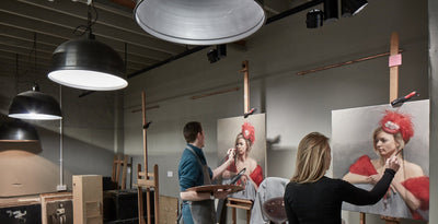 Unique paintings in an art theatre with industrial lighting