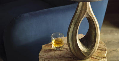 Ornate ellipse table lamp base in a sculptural design, part of the Table Lamp & Floor Lamp Bases collection, styled on a marble side table.