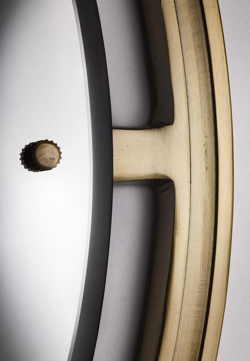 Close up of Albany round wall mirror with aged brass frame, 31-inch