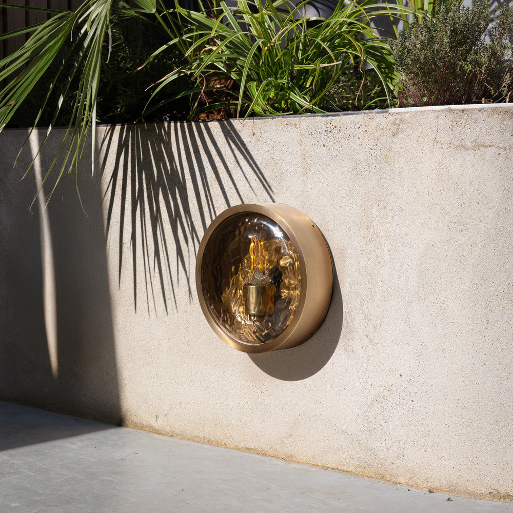 Bulkhead Outdoor & Bathroom Round Wall Light in Brass finish with Hammered Glass lit up