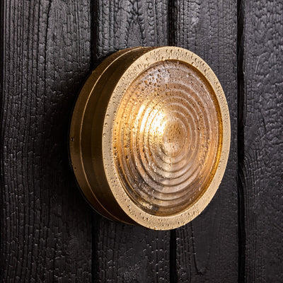 Bulkhead Outdoor & Bathroom Round Wall Light in Brass finish with Ripple Glass lit up