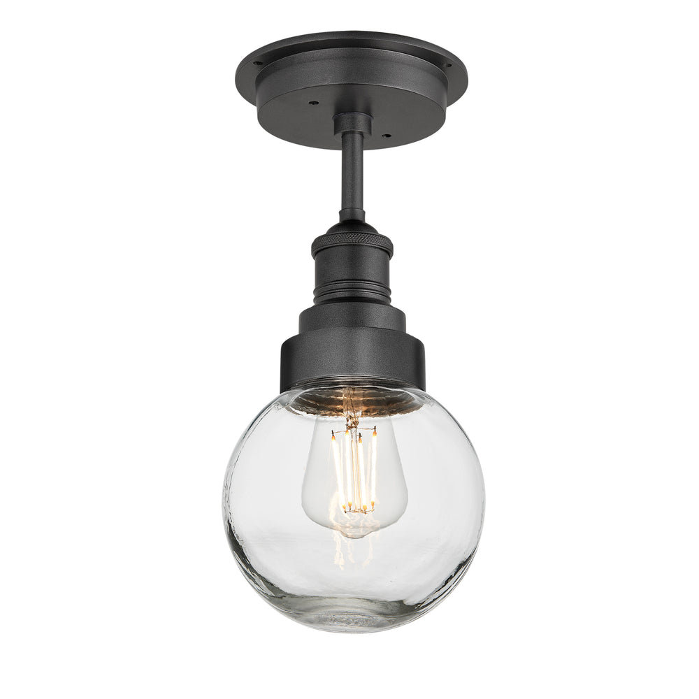 Ceiling light fixture with clear glass shade and black metal fixture on a white background