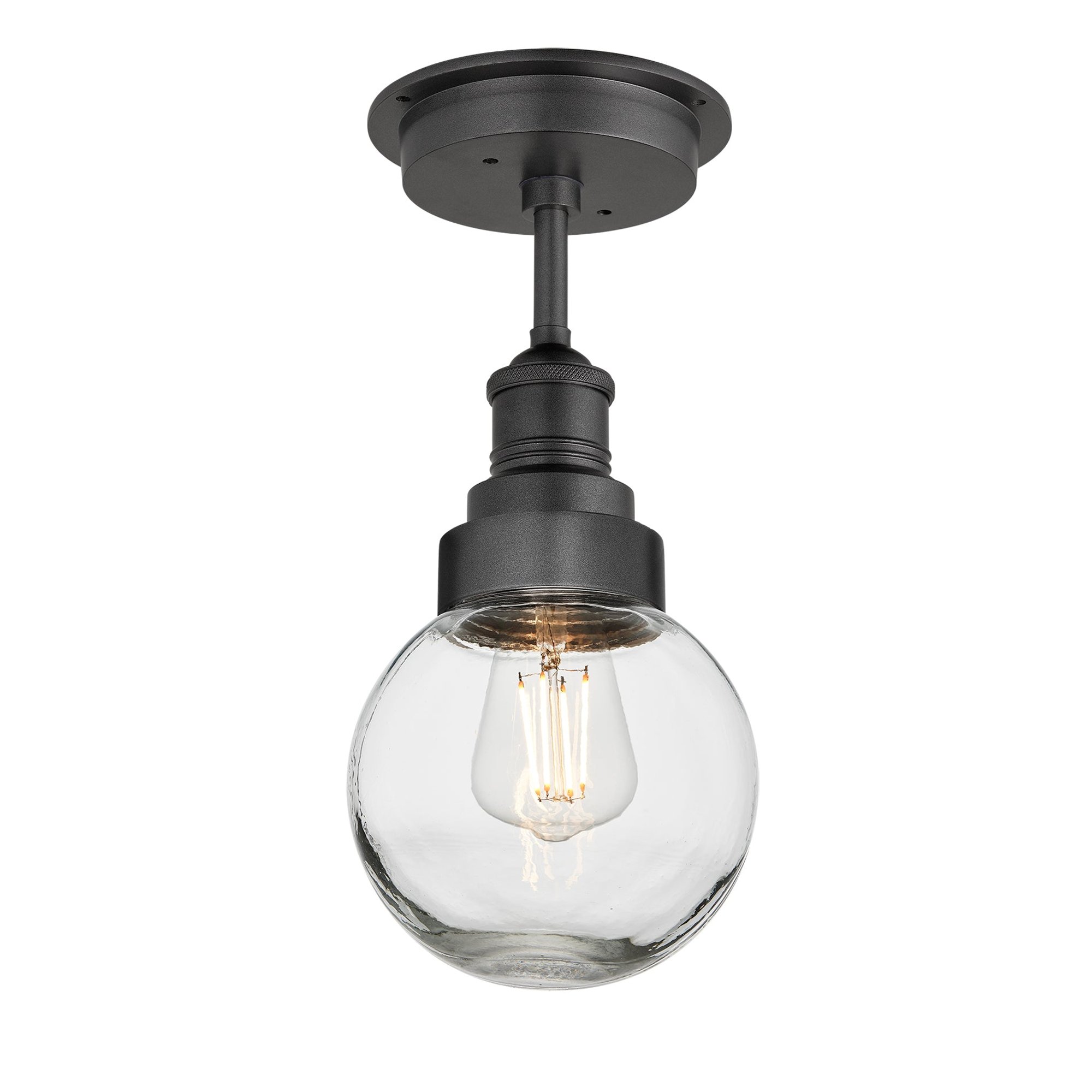 Ceiling light fixture with clear glass shade and black metal fixture on a white background