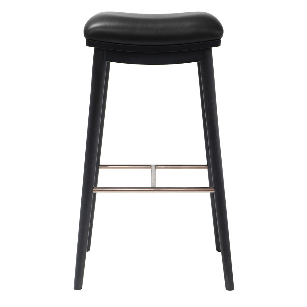 Back view of a bar stool with a black leather seat and black ash wood legs, showcasing the brushed metal footrest.