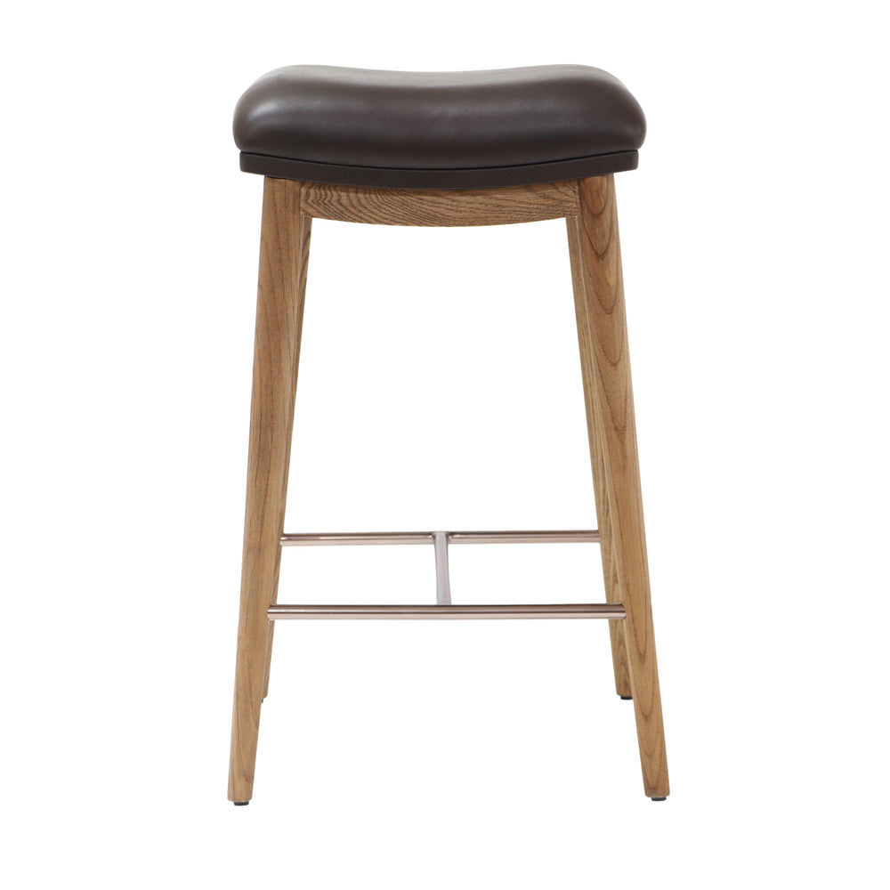 Back view of a counter height stool with natural ash wood legs, a brown soft leather seat, and brushed metal footrest, showing a modern design