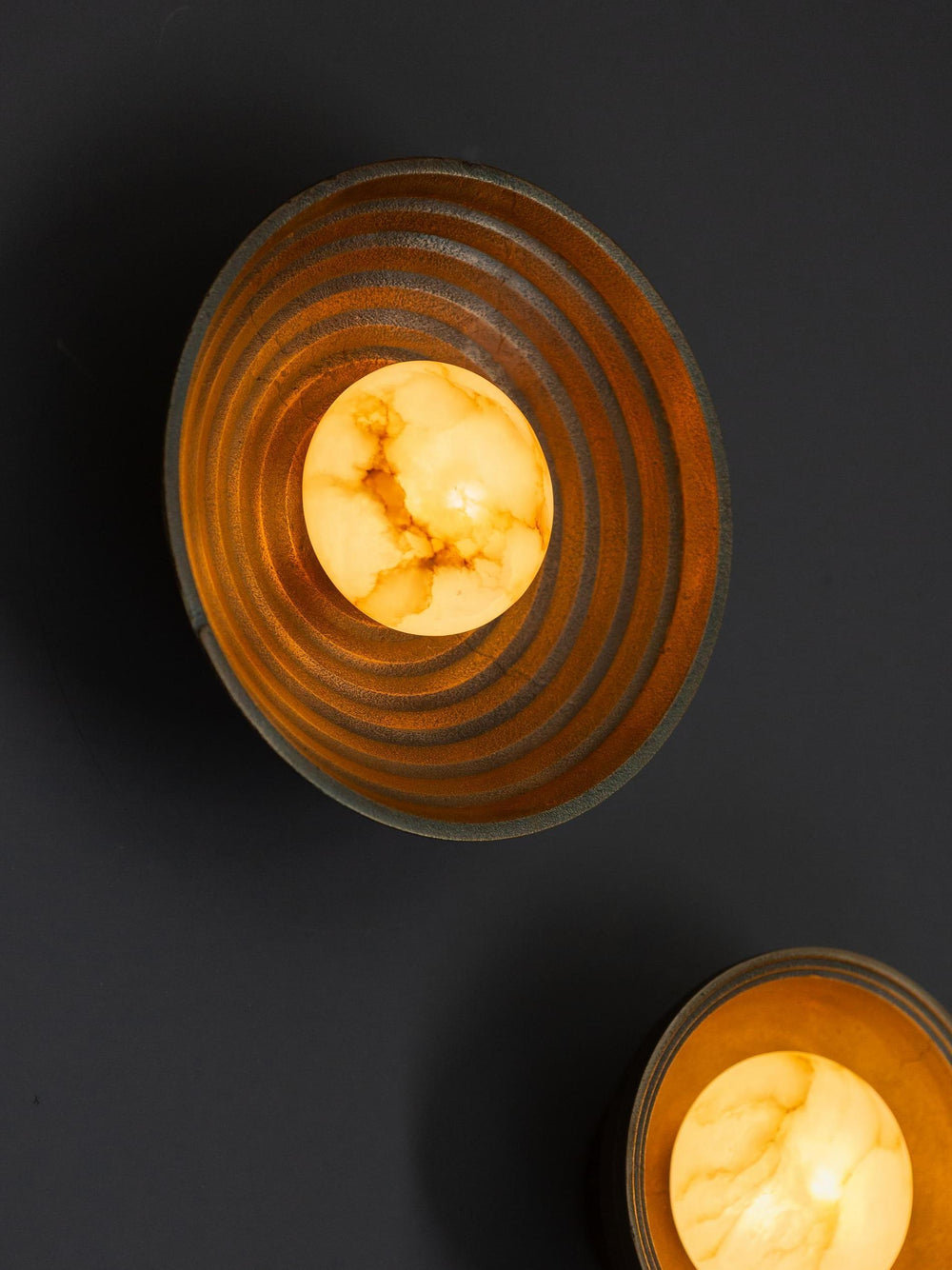 Corby Cast Stepped Diffuser Wall Light 10 Inch in Aged Brass lit up