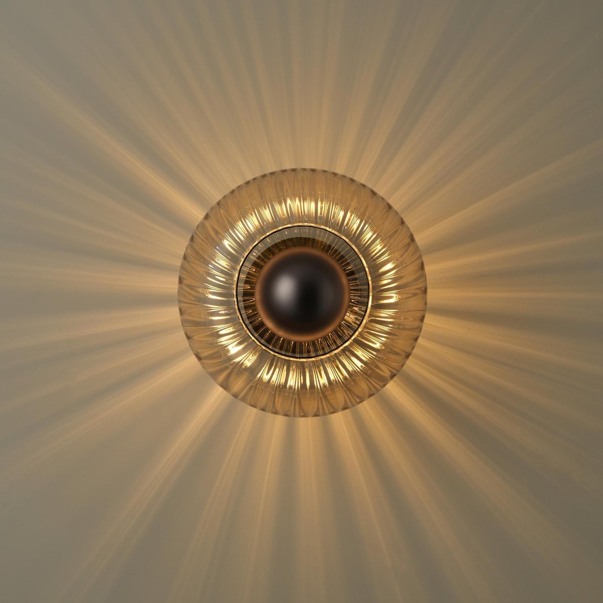 Chelsea Glass Round Diffuser Wall Light Flush Mount with Ribbed Mocha Glass and Bronze Wall Holder lit up
