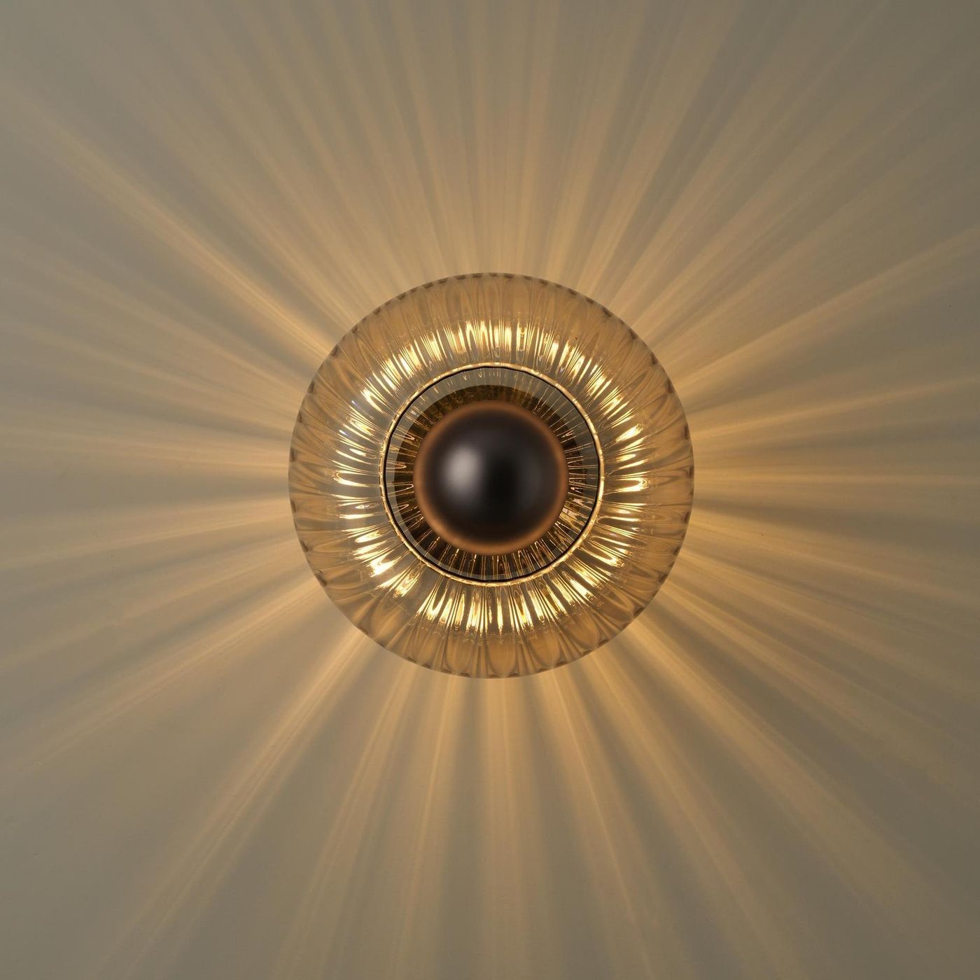 Chelsea Glass Round Diffuser Wall Light Flush Mount with Ribbed Mocha Glass and Bronze Wall Holder lit up