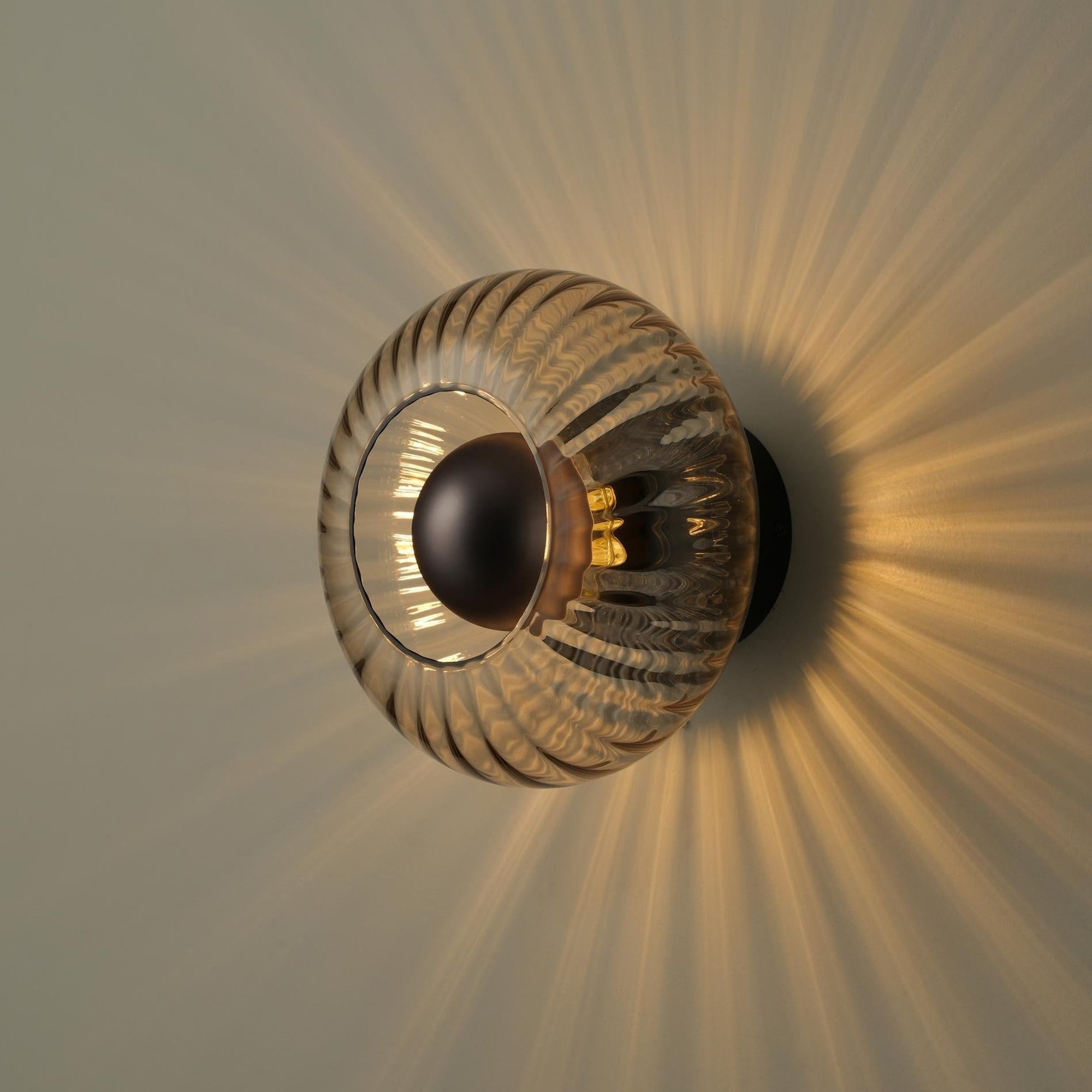 Chelsea Glass Round Diffuser Wall Light Flush Mount with Ribbed Mocha Glass and Bronze Wall Holder lit up