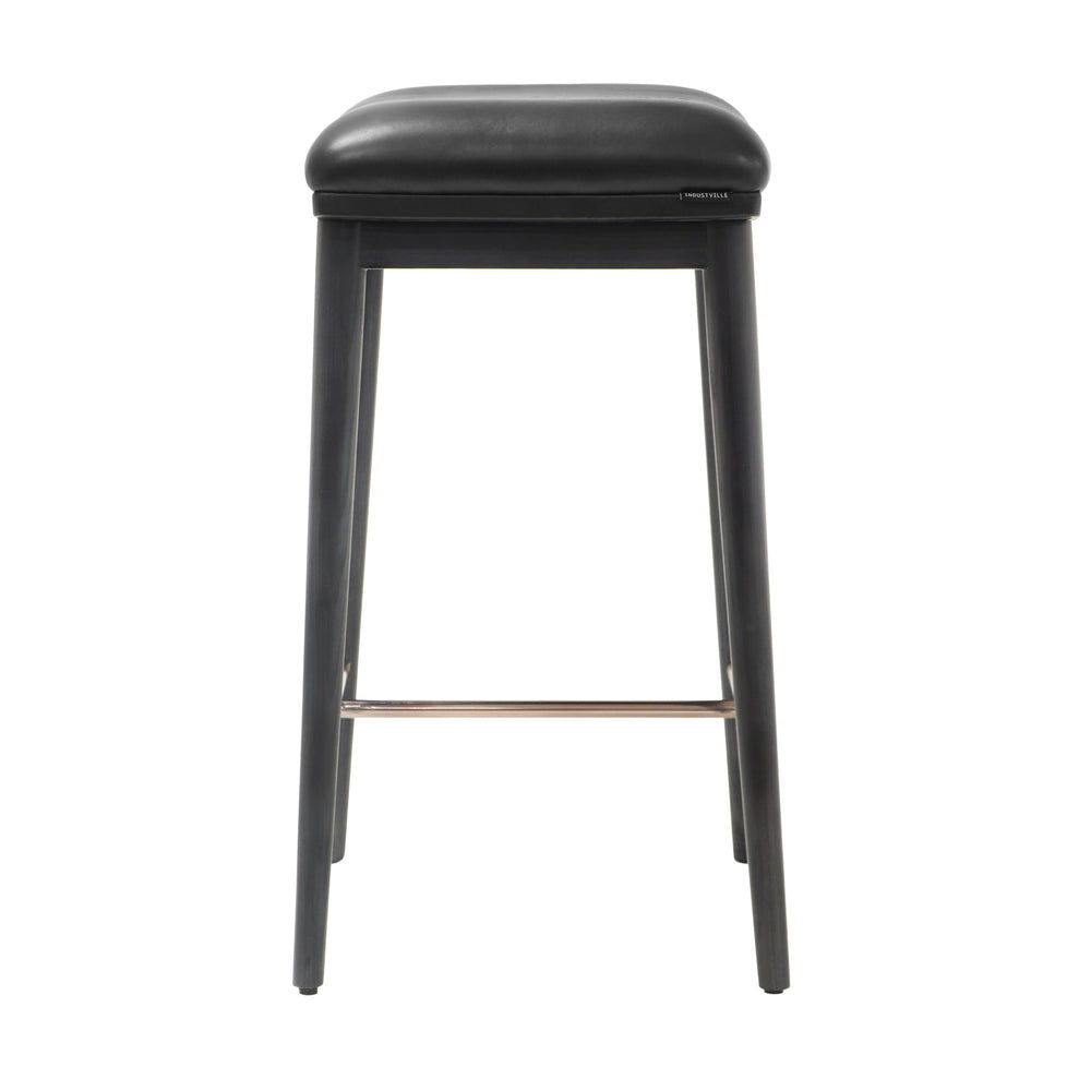 Counter height stool with black ash wood legs, black soft leather seat, and a brushed metal footrest, viewed from the front.