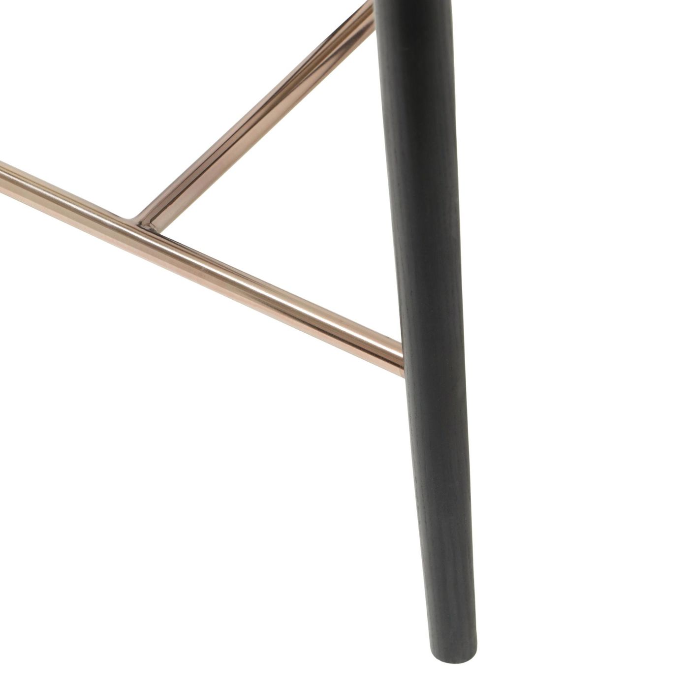 Detail shot of the brushed metal footrest on a bar stool, supported by black ash wood legs, emphasizing the contrast in materials