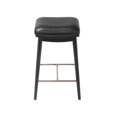 Front view of a counter height stool featuring black ash wood legs, a black soft leather seat, and a brushed metal footrest