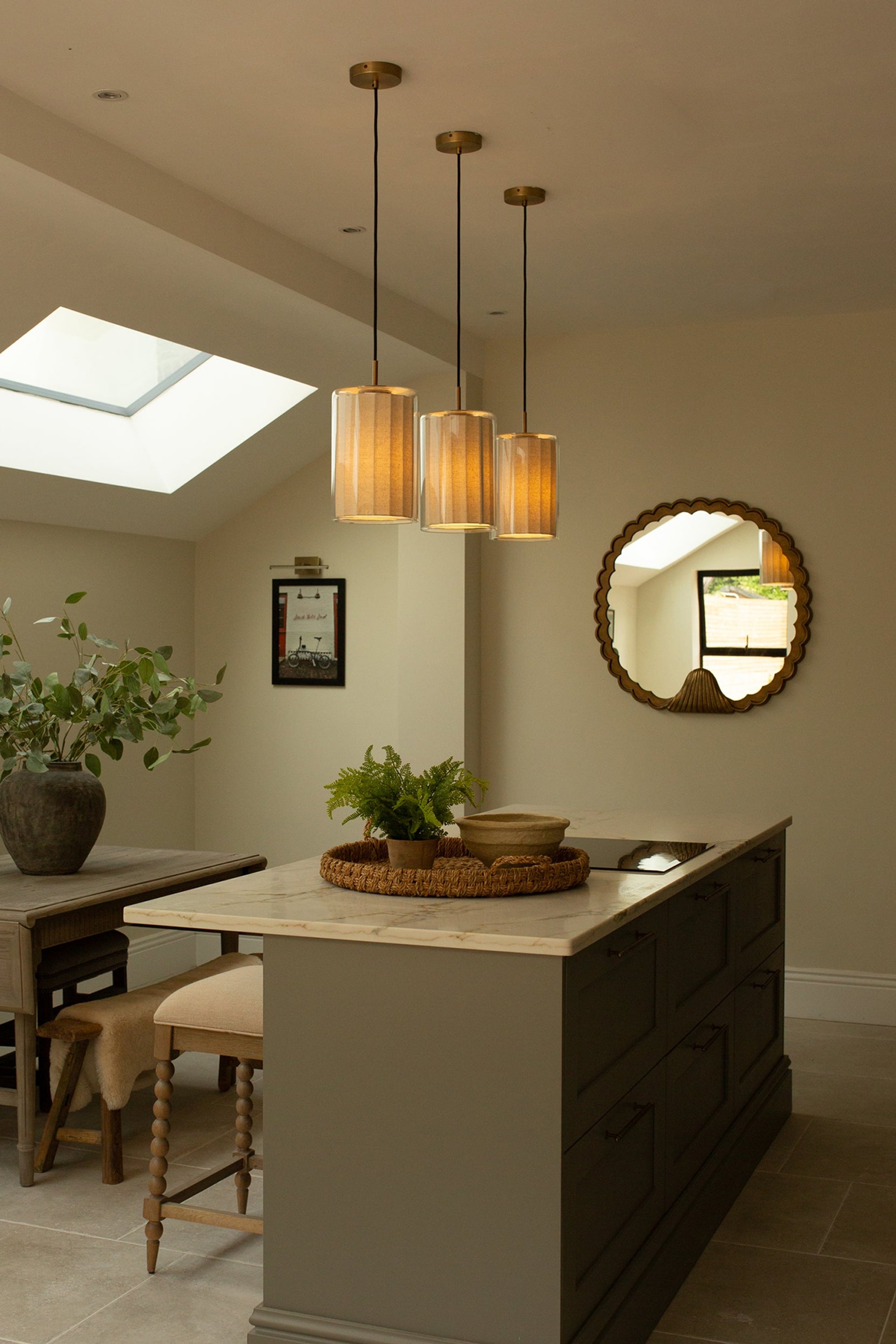 Bude Cylinder Linen Pendant Light in Clear Glass lit up in a kitchen setting