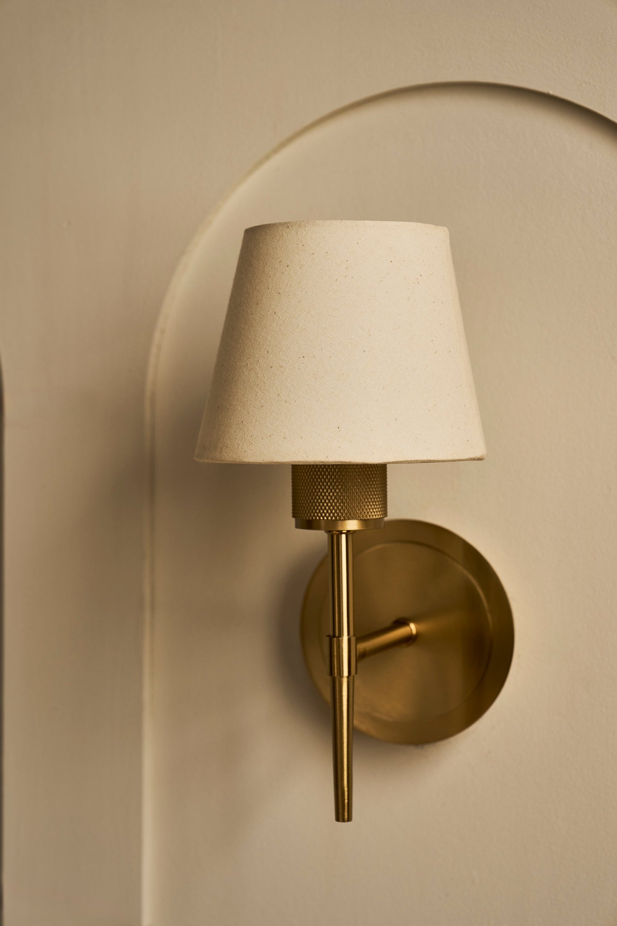Brass Knurled Empire Torch Wall Light with Light Natural Cotton shade