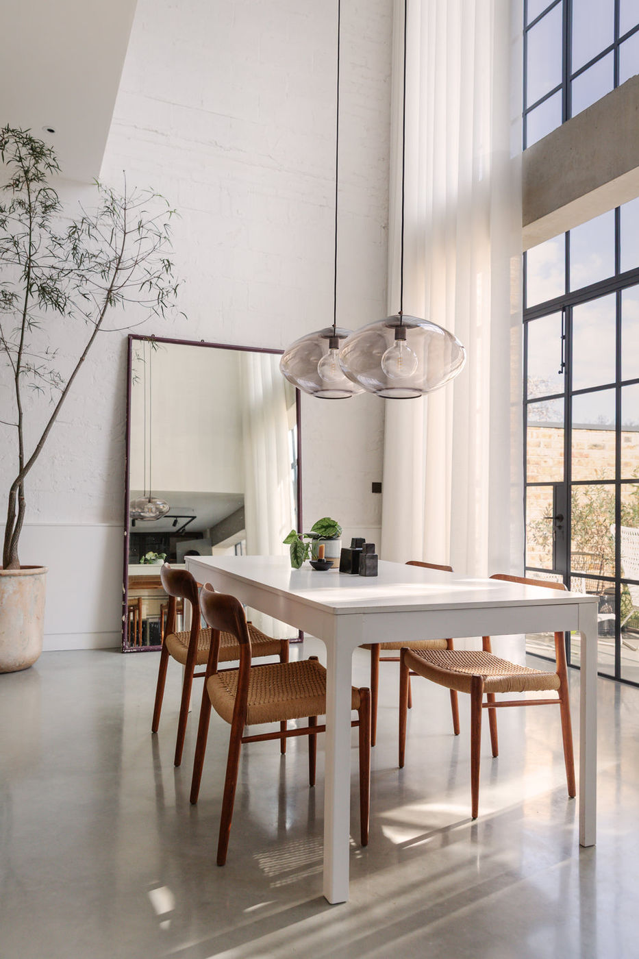 Preston Bronze Mocha Mushroom Glass Pendant in a Modern Dining Space