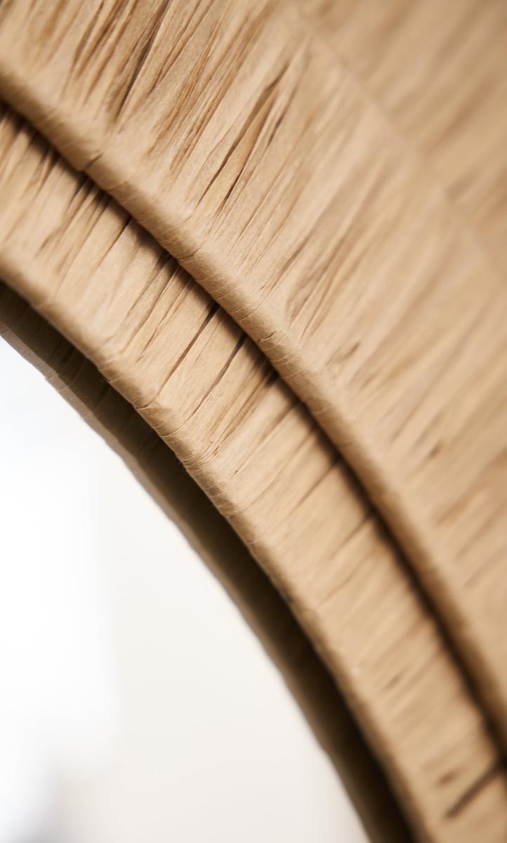 Close up of Raffia Round Wall Mirror in 33 Inch Natural finish