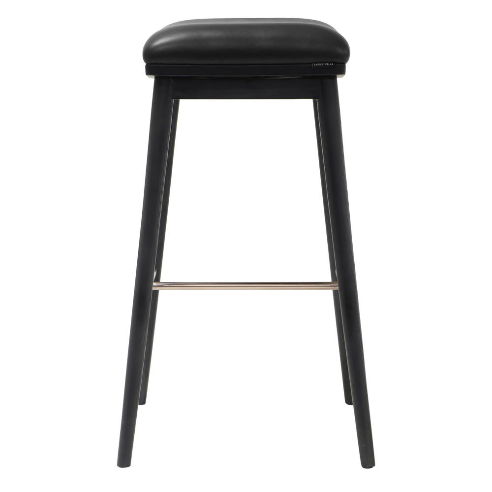 Side profile of a bar stool with black ash wood legs and a padded black leather seat, featuring a minimalist design