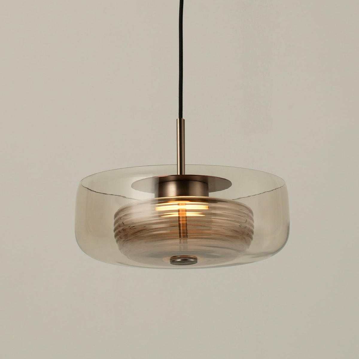 Selby Layered Mocha Glass Round Pendant Light with Bronze holder, lit up
