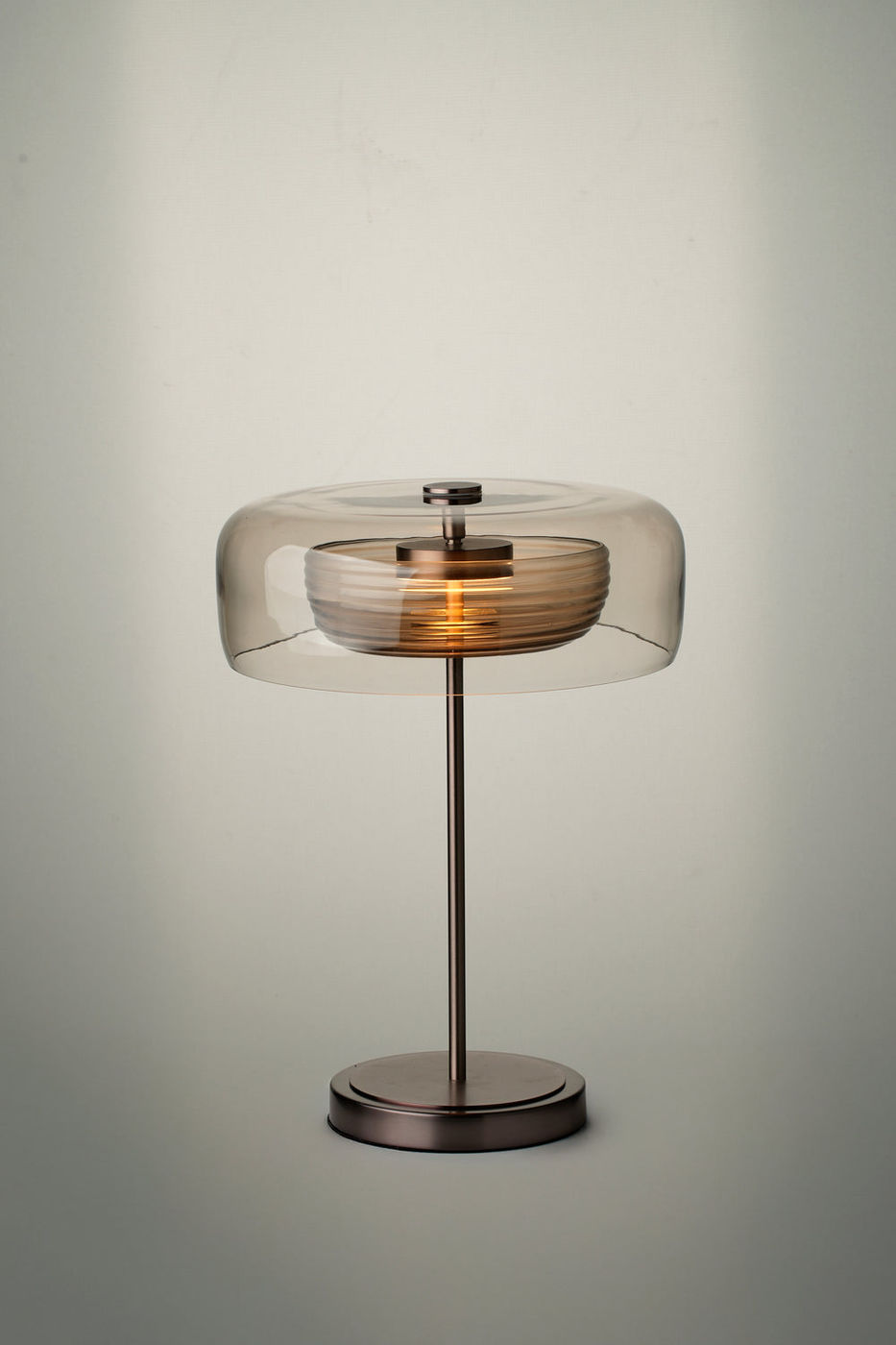 Selby Layered Mocha Glass Round Table Lamp with Bronze base lit up