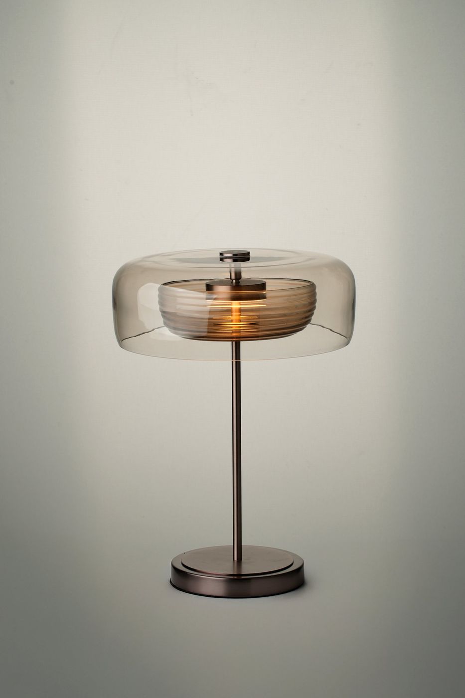Selby Layered Mocha Glass Round Table Lamp with Bronze base lit up