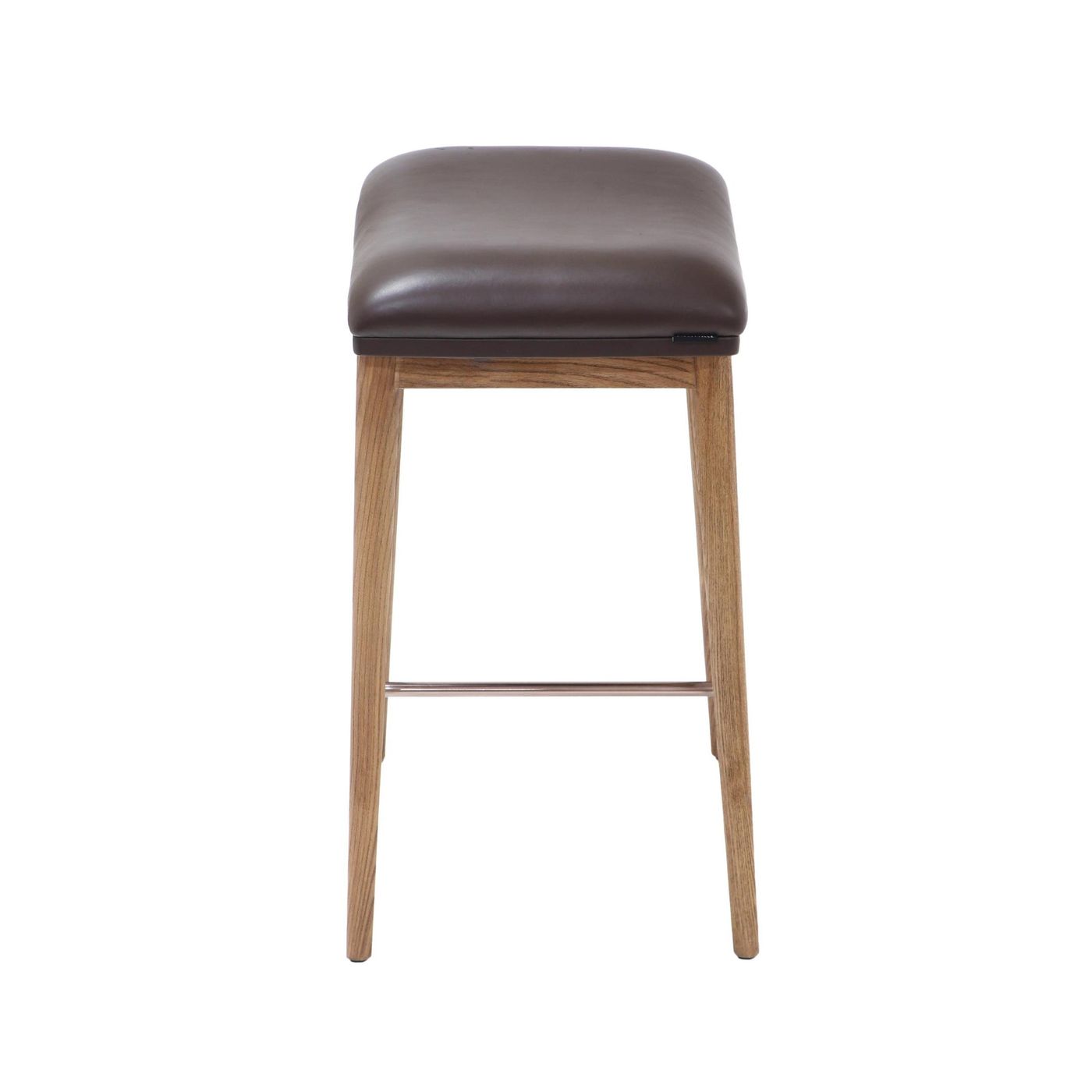 Side view of a counter height stool featuring natural ash wood legs, a brown soft leather seat, and a brushed metal footrest