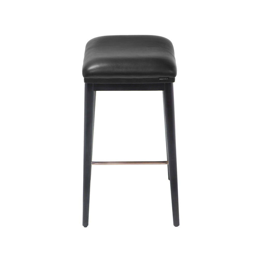 Side view of a counter height stool with black ash wood legs and a black soft leather seat, showcasing the clean lines.