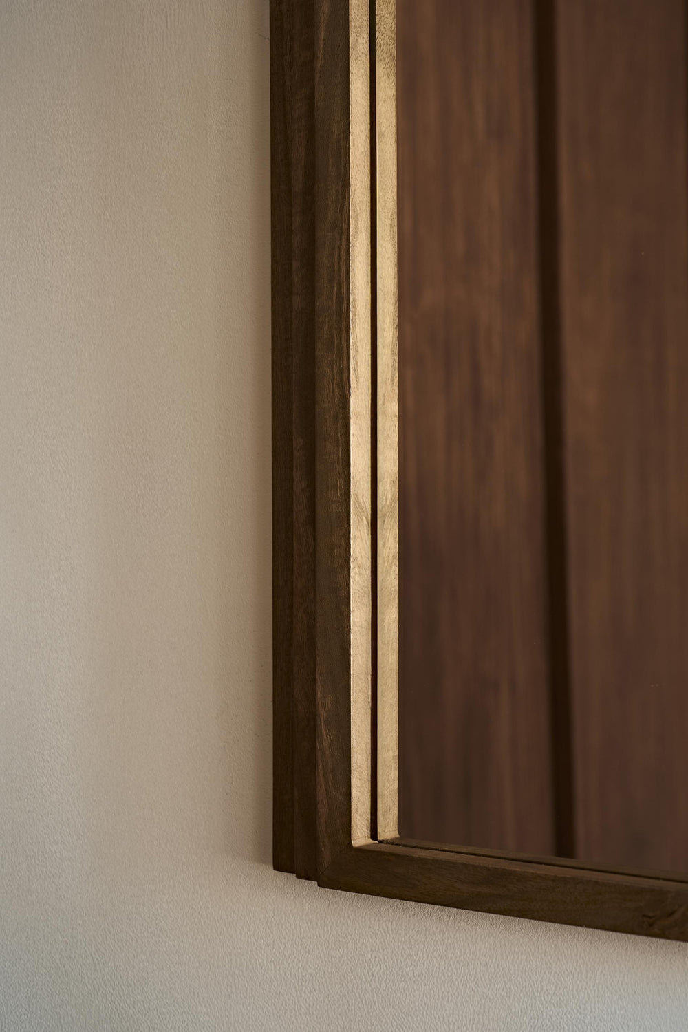 Close up of Walcott arch wall mirror with natural wood frame, 39-inch