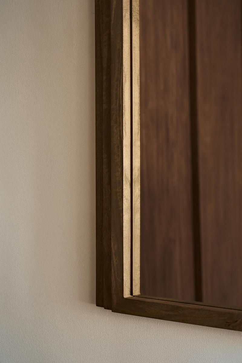 Close up of Walcott arch wall mirror with natural wood frame, 39-inch