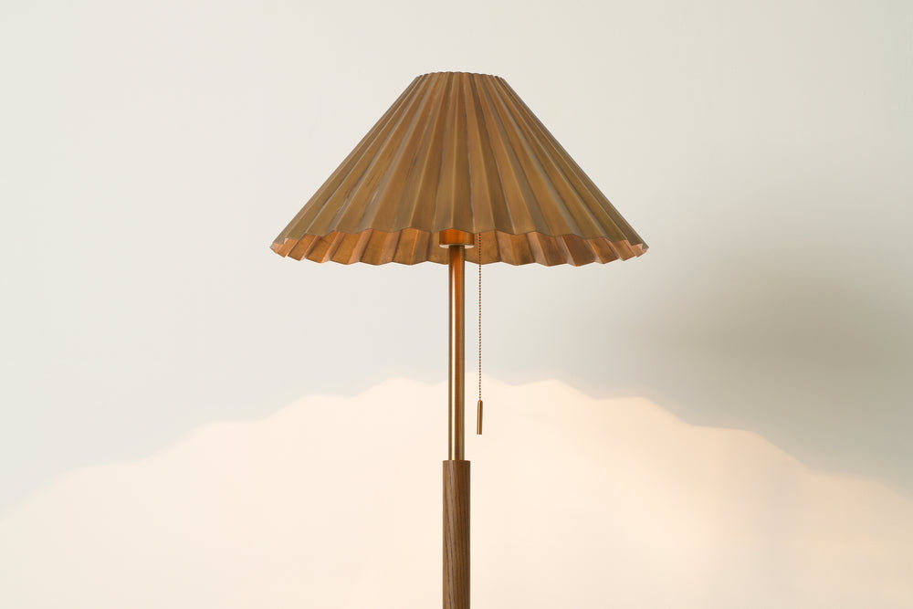 Wycombe Umbrella Pleated Floor Lamp in Brass lit up, close up of the shade