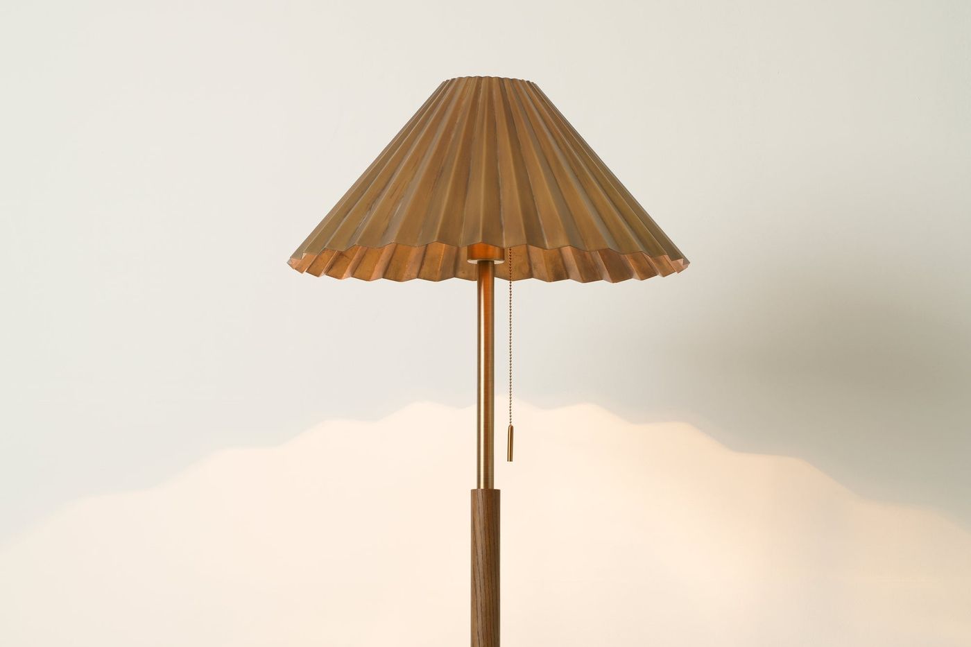 Wycombe Umbrella Pleated Floor Lamp in Brass lit up, close up of the shade