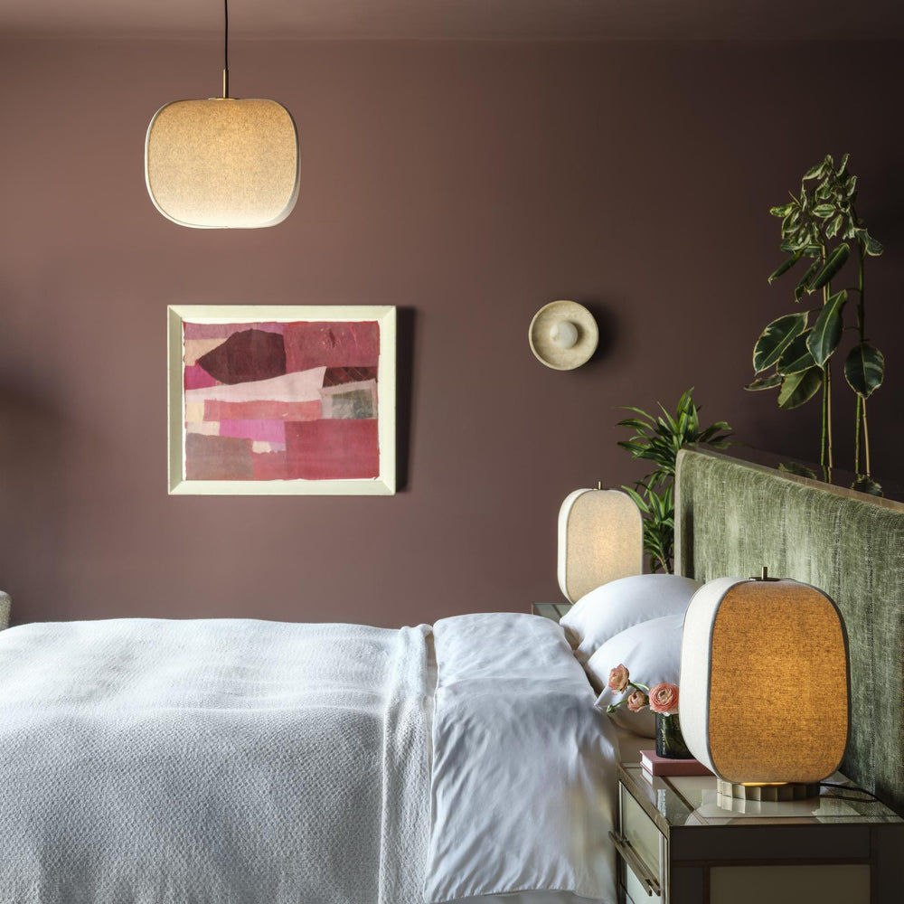 Bloxham Rectangular Table Lamp in Natural Fabric finish lit up in a bedroom setting with Bloxham pendant
