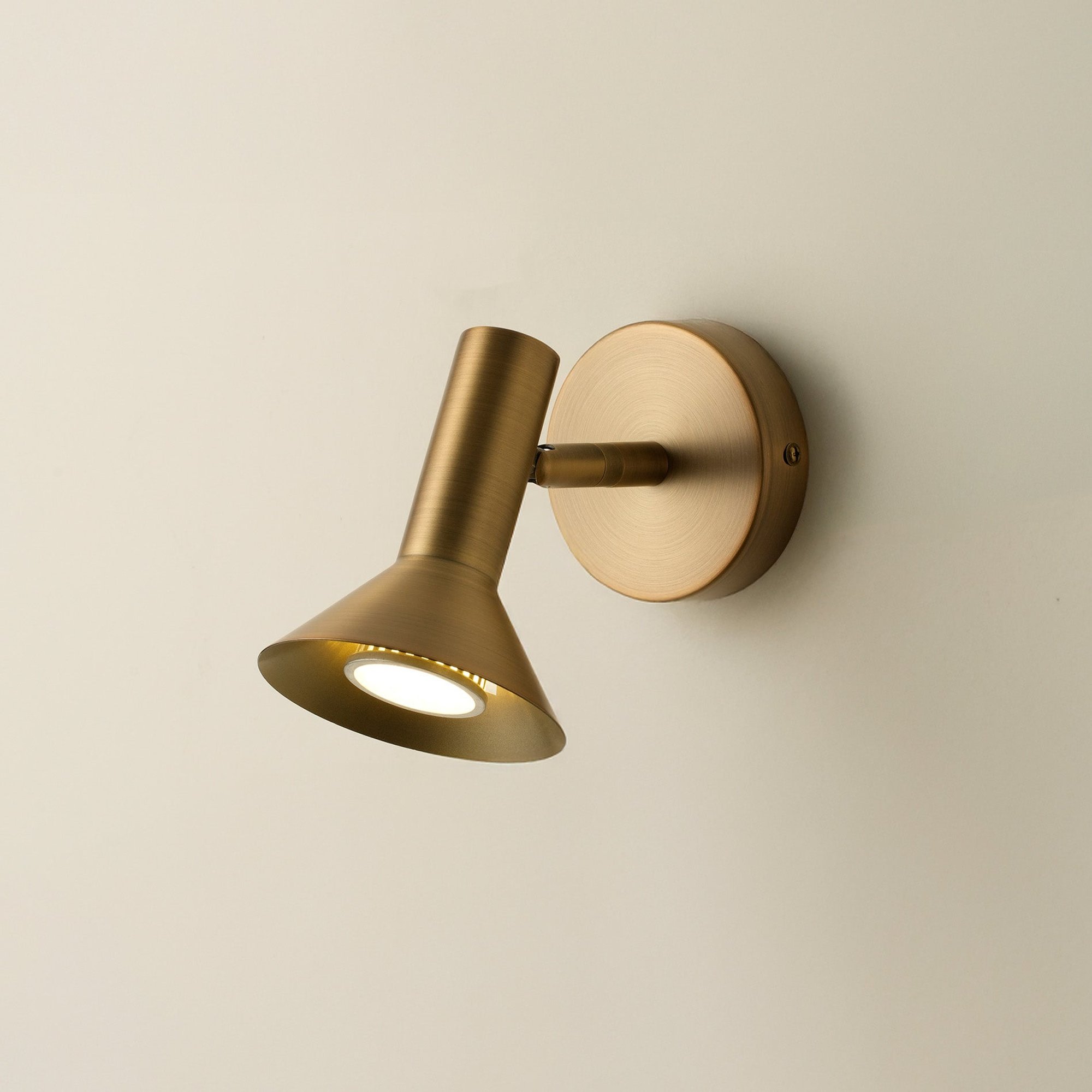 Kemble Spotlight in Brass lit up